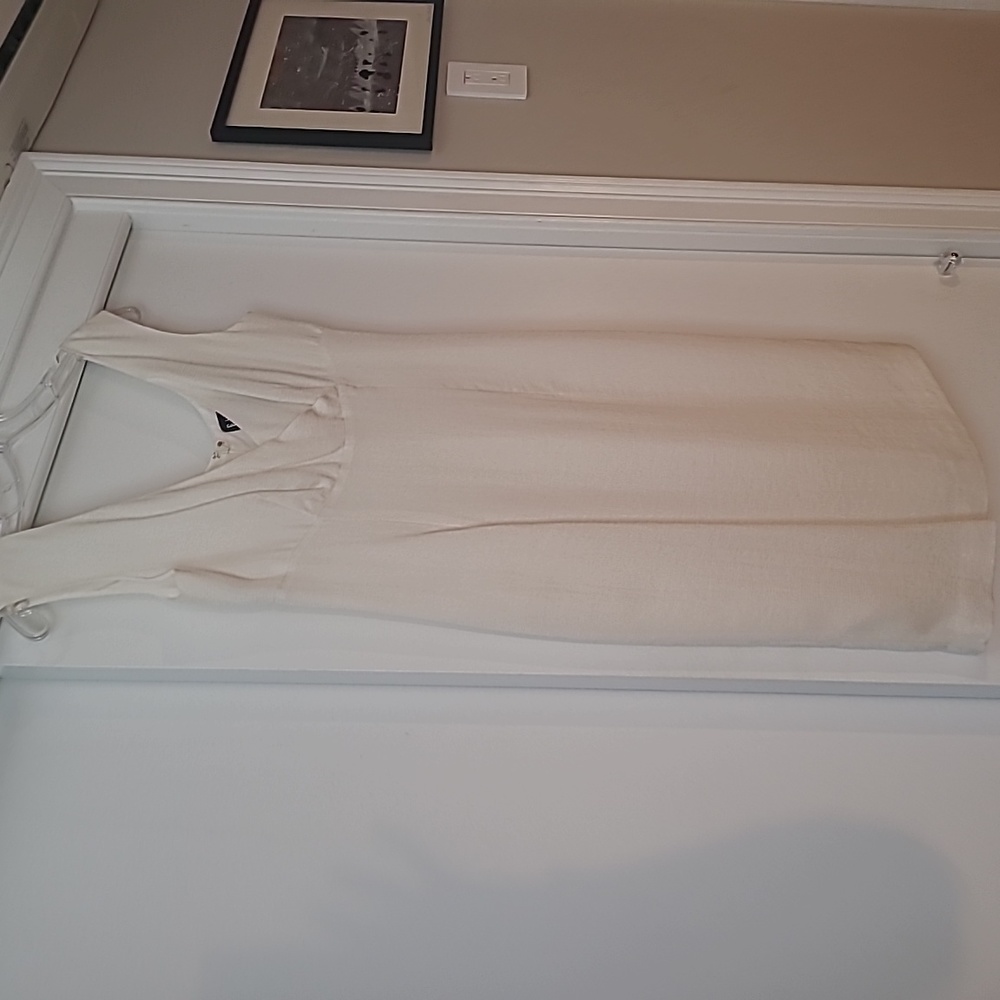 Beautiful linen, fully lined cream dress with crossover neckline.